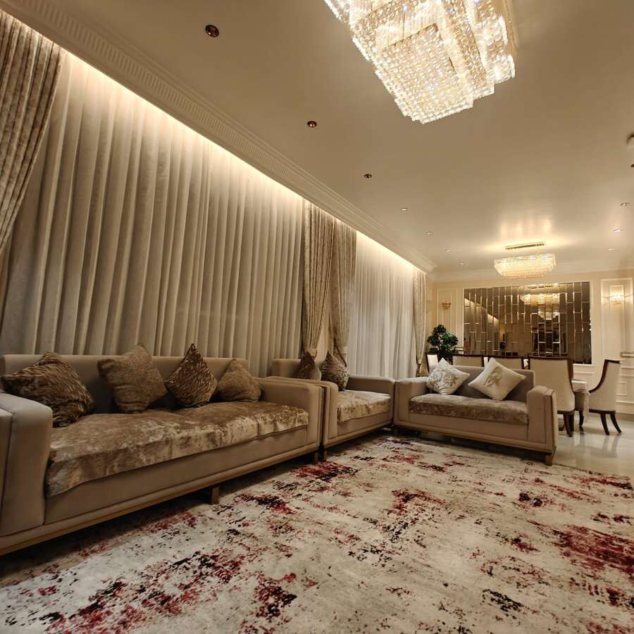 Elegant dining space with a statement mirror, designed by INKA Architects